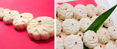 White cookies on pink paper