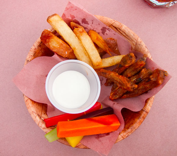Fries and "wings" - duck fat fries, bbq sauced fried tongues, blue cheese dipping sauce and heirloom carrots.