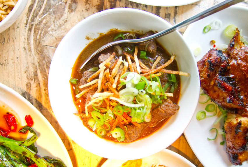 Javanese dark spiced braised beef, crispy potato, and green onion.